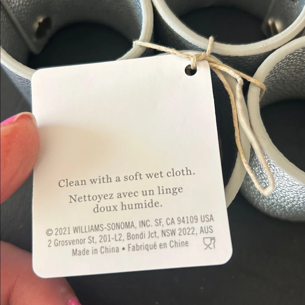 Williams Sonoma set of 12 Faux Shagreen Napkin Rings in Silver.